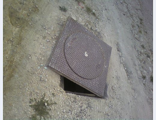 tombino in ghisa strada